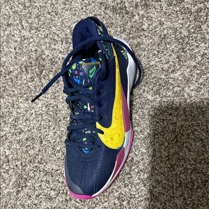 Nike Navy Running Shoe with Yellow Swoosh and Pink Accents